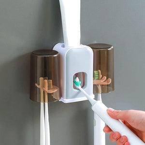 Portacepillos con dispensador automático de pasta de dientes